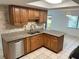 Updated kitchen with stainless steel appliances and granite countertops at 647 Fairmont Ave # C, Safety Harbor, FL 34695