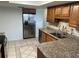 Updated kitchen featuring granite countertops and stainless steel appliances at 647 Fairmont Ave # C, Safety Harbor, FL 34695
