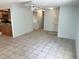 Bright living room with tile flooring, neutral walls, and ceiling fan at 647 Fairmont Ave # C, Safety Harbor, FL 34695