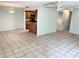 Inviting living area showcasing tile floors, neutral paint, and open access to the kitchen at 647 Fairmont Ave # C, Safety Harbor, FL 34695