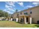 Spacious townhouse backyard features a covered patio, and well-maintained green space, perfect for outdoor relaxation at 6954 Hawthorne Trace Ln, Riverview, FL 33578