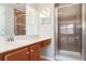 This full bathroom features a tile shower and a wood vanity at 6954 Hawthorne Trace Ln, Riverview, FL 33578