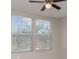 Bedroom with two windows, blinds, and a ceiling fan at 6954 Hawthorne Trace Ln, Riverview, FL 33578