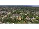 Elevated perspective showcasing a tranquil pond, lush landscapes, and residential allure from above at 768 Pinellas Point S Dr, St Petersburg, FL 33705