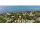 Stunning aerial view of the property and the waterfront location with boats, piers, and bridges at 768 Pinellas Point S Dr, St Petersburg, FL 33705