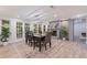 Charming dining room with fireplace and a view of the outdoor space through french doors at 768 Pinellas Point S Dr, St Petersburg, FL 33705