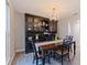 Dining room with wood floors, traditional-style furniture, chandelier, and decorative hutch at 768 Pinellas Point S Dr, St Petersburg, FL 33705
