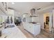 Kitchen featuring a large island with granite countertops and stainless steel appliances at 768 Pinellas Point S Dr, St Petersburg, FL 33705