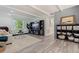 Bright and airy living room featuring stylish decor and a charming brick accent wall at 768 Pinellas Point S Dr, St Petersburg, FL 33705