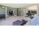 Inviting outdoor patio with comfortable seating and seamless transition to an indoor living area at 768 Pinellas Point S Dr, St Petersburg, FL 33705