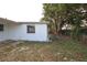 View of the side yard with mature tree providing shade and privacy at 7904 Judith Cres, Port Richey, FL 34668