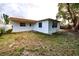 Backyard of home featuring lush greenery and a fenced perimeter at 7904 Judith Cres, Port Richey, FL 34668