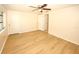 Bedroom featuring hardwood floors, a ceiling fan, two closets, and two doors at 7904 Judith Cres, Port Richey, FL 34668