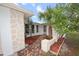 Charming front entrance with brick walkway, fresh mulch landscaping, and stylish stone accents at 7904 Judith Cres, Port Richey, FL 34668