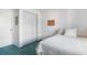 Well-lit bedroom with comfortable bed, storage, and minimalist decor at 801 83Rd N Ave # 209, St Petersburg, FL 33702