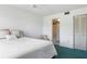 Bedroom showcasing a comfortable bed, ensuite bathroom, and closet at 801 83Rd N Ave # 209, St Petersburg, FL 33702