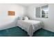 Cozy bedroom with natural light, a comfortable bed, and minimalist decor at 801 83Rd N Ave # 209, St Petersburg, FL 33702