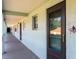 Exterior hallway with doors to units and view of palms in the distance at 801 83Rd N Ave # 209, St Petersburg, FL 33702