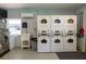 Conveniently located community laundry room featuring multiple washers and dryers at 801 83Rd N Ave # 209, St Petersburg, FL 33702