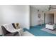Bright living room with seating area, round mirror, and natural lighting at 801 83Rd N Ave # 209, St Petersburg, FL 33702