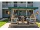 Inviting outdoor swing seating area perfect for relaxing and enjoying the community's peaceful atmosphere at 801 83Rd N Ave # 209, St Petersburg, FL 33702