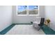 Bright room with large window, comfortable chair, and side table at 801 83Rd N Ave # 209, St Petersburg, FL 33702