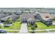 Aerial view of a beautiful home nestled in a Primary-planned community with landscaped yards and sidewalks at 8296 Olive Brook Dr, Wesley Chapel, FL 33545