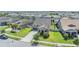 Aerial view of a lovely home situated in a vibrant neighborhood with green lawns and mature trees at 8296 Olive Brook Dr, Wesley Chapel, FL 33545