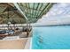 Outdoor bar by the lagoon, perfect for enjoying refreshing drinks with a view at 8296 Olive Brook Dr, Wesley Chapel, FL 33545