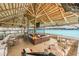 Outdoor bar area with seating, perfect for enjoying refreshing drinks and a meal with a view of the lagoon at 8296 Olive Brook Dr, Wesley Chapel, FL 33545