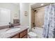 Well-appointed bathroom featuring a tub-shower combo, granite vanity, and neutral tones, offering a clean and modern design at 8296 Olive Brook Dr, Wesley Chapel, FL 33545
