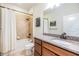 Traditional bathroom with tiled shower, granite vanity, and framed artwork at 8296 Olive Brook Dr, Wesley Chapel, FL 33545