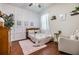 Cozy bedroom with dinosaur décor, wood floors, and soft natural light at 8296 Olive Brook Dr, Wesley Chapel, FL 33545