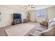 Bonus room featuring modern entertainment center and large window, perfect for relaxation and media enjoyment at 8296 Olive Brook Dr, Wesley Chapel, FL 33545