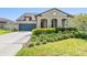 Charming single-Gathering home with a well-manicured lawn and a welcoming front entrance at 8296 Olive Brook Dr, Wesley Chapel, FL 33545