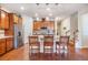 Modern kitchen with hardwood floors, granite countertops, lots of cabinet space and stainless steel appliances at 8296 Olive Brook Dr, Wesley Chapel, FL 33545