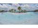 Scenic view of the lagoon featuring clear turquoise water and sandy beaches, ideal for swimming and sunbathing at 8296 Olive Brook Dr, Wesley Chapel, FL 33545