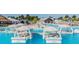 Floating cabanas and lounge chairs offering a relaxing spot in the serene lagoon setting at 8296 Olive Brook Dr, Wesley Chapel, FL 33545
