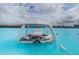 Relax and unwind in a private covered floating deck on a scenic crystal-clear lagoon at 8296 Olive Brook Dr, Wesley Chapel, FL 33545