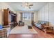 A traditionally styled living room features lots of light, lovely wood accents and a neutral color palette at 8296 Olive Brook Dr, Wesley Chapel, FL 33545