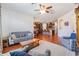 An open-concept living area features a bright kitchen with stainless steel appliances and eat-in dining at 8296 Olive Brook Dr, Wesley Chapel, FL 33545
