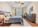 Main bedroom features hardwood floors, ample natural light, and exercise equipment, creating a versatile space at 8296 Olive Brook Dr, Wesley Chapel, FL 33545