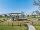 Well-equipped community playground features a shaded play area, swings, and slides for Gathering fun and outdoor activity at 8296 Olive Brook Dr, Wesley Chapel, FL 33545