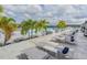 Relaxing poolside retreat with lounge chairs and shaded cabanas overlooking the sparkling blue water at 8296 Olive Brook Dr, Wesley Chapel, FL 33545