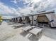 Elegant poolside lounge area with cabanas and comfortable seating, perfect for relaxation and luxury at 8296 Olive Brook Dr, Wesley Chapel, FL 33545