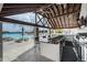 Stylish poolside bar area with modern appliances and comfortable seating, perfect for entertaining guests at 8296 Olive Brook Dr, Wesley Chapel, FL 33545