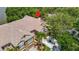 Aerial view of townhomes with well-kept landscaping, paver driveways and beautiful mature trees at 8576 Sandy Beach St, Tampa, FL 33634