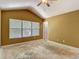 Bedroom with large window and vaulted ceiling at 8576 Sandy Beach St, Tampa, FL 33634