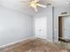 A bedroom with a closet and entry to another room at 8576 Sandy Beach St, Tampa, FL 33634