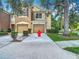 Two story townhome with attached garages and a well maintained lawn and landscaping at 8576 Sandy Beach St, Tampa, FL 33634